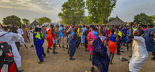 dancing at a traditional Dinka wedding ceremony